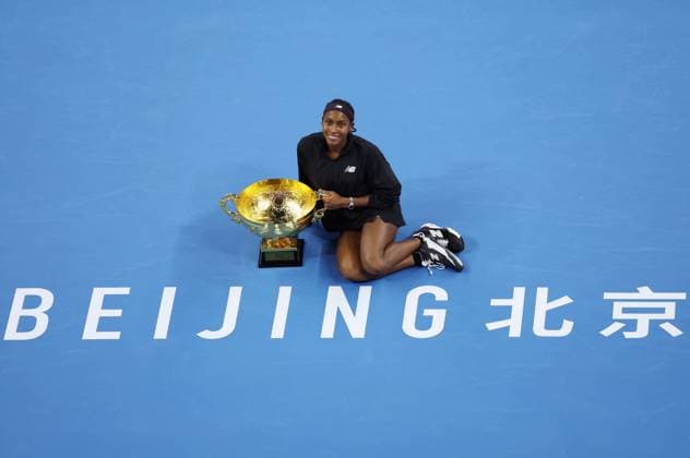 (241006) -- BEIJING, Oct. 6, 2024 -- Winner Coco Gauff of the United States poses with her trophy after winning the women s singles final match against Karolina Muchova of the Czech Republic at the 2024 China Open tennis tournament in Beijing, China, Oct. 6, 2024. ) (SP)CHINA-BEIJING-TENNIS-CHINA OPEN-WOMEN S SINGLES-FINAL (CN) ZhangxChenlin 