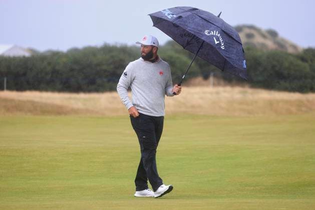 6th October 2024; The Old Course at St Andrews, Fife, Scotland; Alfred Dunhill Links Golf Championship, Final Round; Jon Rahm of Spain shelters under an umbrella on the fairway of the fourteenth hole of the Old Course, St Andrews, during the final round of the Dunhill Links Championship  ActionPlus12701335 DavidxYoung
