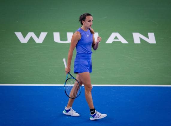 (241007) -- WUHAN, Oct. 7, 2024 -- Clara Burel of France celebrates a score during the women s singles round of 64 match against Yuan Yue of China at the 2024 Wuhan Open tennis tournament in Wuhan, capital of central China s Hubei Province, Oct. 7, 2024. ) (SP)CHINA-WUHAN-TENNIS-WUHAN OPEN-WOMEN S SINGLES (CN) HuxJingwen 
