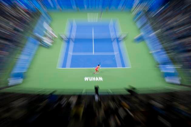 (241007) -- WUHAN, Oct. 7, 2024 -- Yuan Yue of China hits a return during the women s singles round of 64 match against Clara Burel of France at the 2024 Wuhan Open tennis tournament in Wuhan, capital of central China s Hubei Province, Oct. 7, 2024. ) (SP)CHINA-WUHAN-TENNIS-WUHAN OPEN-WOMEN S SINGLES (CN) WuxZhizun 