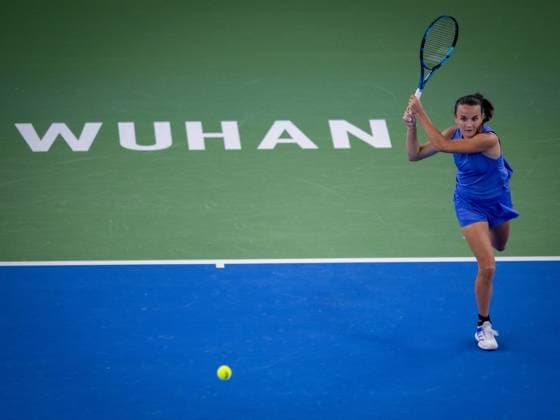 (241007) -- WUHAN, Oct. 7, 2024 -- Clara Burel of France hits a return during the women s singles round of 64 match against Yuan Yue of China at the 2024 Wuhan Open tennis tournament in Wuhan, capital of central China s Hubei Province, Oct. 7, 2024. ) (SP)CHINA-WUHAN-TENNIS-WUHAN OPEN-WOMEN S SINGLES (CN) HuxJingwen 