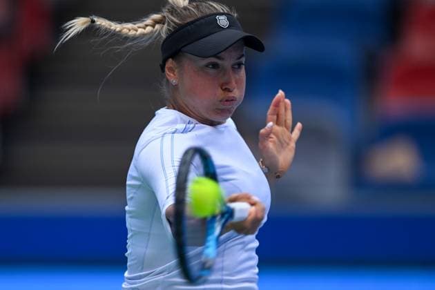 (241008) -- WUHAN, Oct. 8, 2024 -- Yulia Putintseva of Kazakhstan hits a return during the women s singles round of 64 match against Zhang Shuai of China at the 2024 Wuhan Open tennis tournament in Wuhan, capital of central China s Hubei Province, Oct. 8, 2024. ) (SP)CHINA-WUHAN-TENNIS-WUHAN OPEN-WOMEN S SINGLES (CN) WuxZhizun 