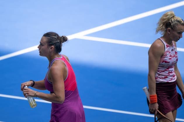 (241009) -- WUHAN, Oct. 9, 2024 -- Aryna Sabalenka (L) and Katerina Siniakova react during the women s singles round of 32 match between Aryna Sabalenka of Belarus and Katerina Siniakova of the Czech Republic at the 2024 Wuhan Open tennis tournament in Wuhan, capital of central China s Hubei Province, Oct. 9, 2024. ) (SP)CHINA-WUHAN-TENNIS-WUHAN OPEN-WOMEN S SINGLES(CN) XiaoxYijiu 