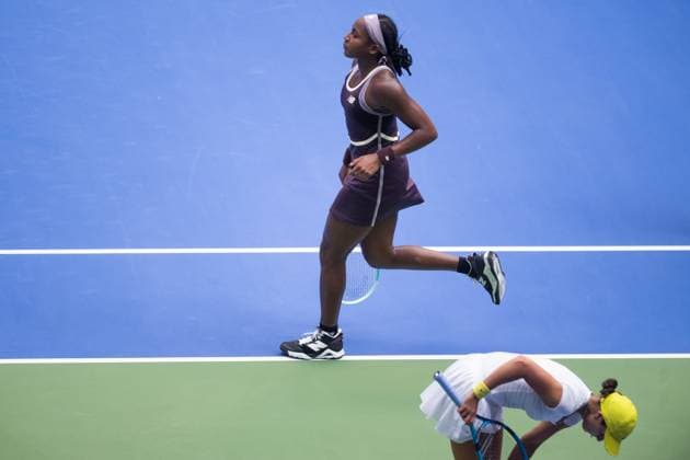 (241009) -- WUHAN, Oct. 9, 2024 -- Coco Gauff (top) of the United States reacts during the women s singles round of 32 match against Viktoriya Tomova of Bulgaria at the 2024 Wuhan Open tennis tournament in Wuhan, capital of central China s Hubei Province, Oct. 9, 2024. ) (SP)CHINA-WUHAN-TENNIS-WUHAN OPEN-WOMEN S SINGLES (CN) XiaoxYijiu 