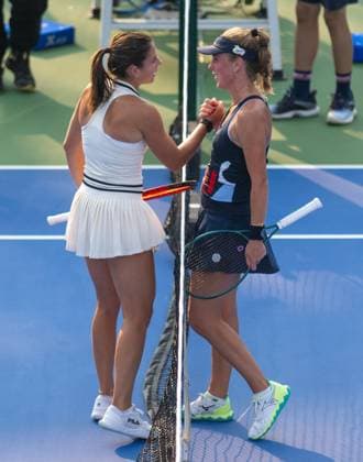 (241009) -- WUHAN, Oct. 9, 2024 -- Magdalena Frech of Poland greets Emma Navarro of the United States during the women s singles round of 32 match at the 2024 Wuhan Open tennis tournament in Wuhan, capital of central China s Hubei Province, Oct. 9, 2024. ) (SP)CHINA-WUHAN-TENNIS-WUHAN OPEN-WOMEN S SINGLES(CN) HuxJingwen 
