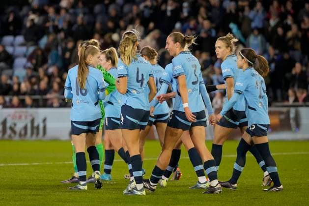 9th October 2024; Joie Stadium, Manchester, England; UEFA Womens Champions League Football, Manchester City versus Barcelona; Manchester City players celebrate with goal scorer Naomi Layzell of Manchester City for 1-0 in the 36th minute  ActionPlus12701970 StevenxFlynn