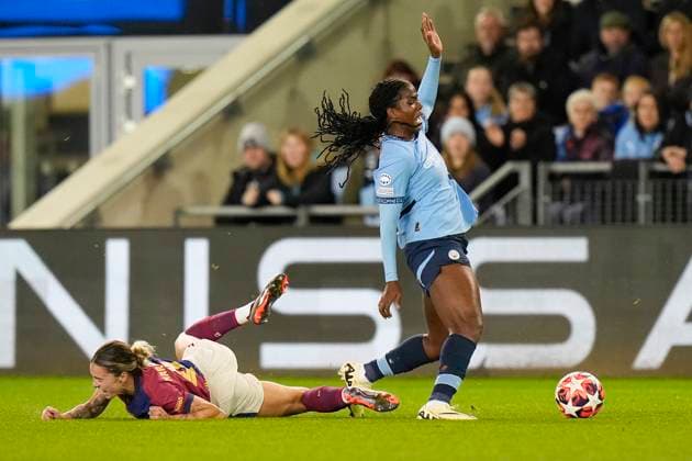 9th October 2024; Joie Stadium, Manchester, England; UEFA Womens Champions League Football, Manchester City versus Barcelona; Khadija Shaw of Manchester City is fouled by Mapi Leon of Barcelona women  ActionPlus12702116 StevenxFlynn