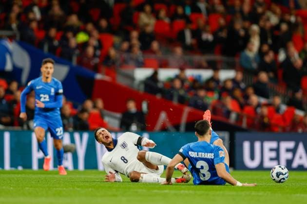Jude Bellingham of England being tackled by Konstantinos Koulierakis of Greece during the UEFA Nations League match England v Greece, Football, UEFA Nations League, Wembley Stadium, Wembley, London, UK - 10 10 2024 Editorial use only  Copyright: xMATTHEWxIMPEY Shutterstockx 14774495ac