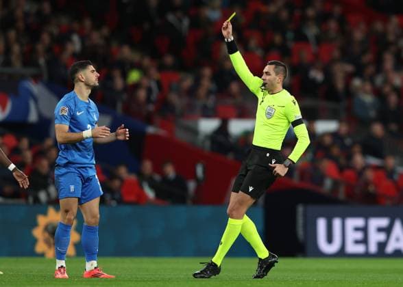 London, England, 10th October 2024.Konstantinos Koulierakis is shown a yellow card during the UEFA Nations League match at Wembley Stadium, London. Picture credit should read: Paul Terry Sportimage EDITORIAL USE ONLY. No use with unauthorised audio, video, data, fixture lists, club league logos or live services. Online in-match use limited to 120 images, no video emulation. No use in betting, games or single club league player publications. SPI-3369-0012