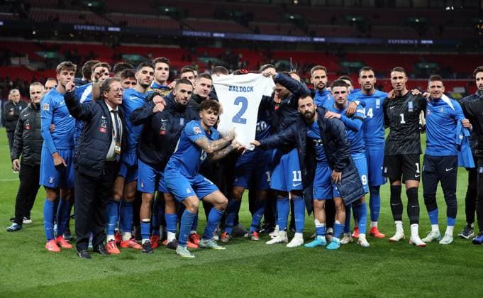 Greece players holds up George Baldock shirt England v Greece - UEFA Nations League - League B - Group 2. Football. Wembey Stadium, London. UK. 10 OCT 2024 Editorial use only  Copyright: xJASONPIX Shutterstockx 14774704as