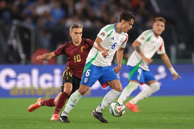 Rome, Italy, 10th October 2024. Mateo Retegui of Italy looks on as team mate Samuele Ricci is pursued by Leandro Trossard of Belgium during the UEFA Nations League match at Stadio Olimpico, Rome. Picture credit should read: Jonathan Moscrop Sportimage EDITORIAL USE ONLY. No use with unauthorised audio, video, data, fixture lists, club league logos or live services. Online in-match use limited to 120 images, no video emulation. No use in betting, games or single club league player publications. SPI-3351-0059