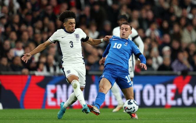 Rico Lewis of England with Dimitrios Pelkas of Greece England v Greece - UEFA Nations League - League B - Group 2. Football. Wembey Stadium, London. UK. 10 OCT 2024 Editorial use only  Copyright: xJASONPIX Shutterstockx 14774704hp