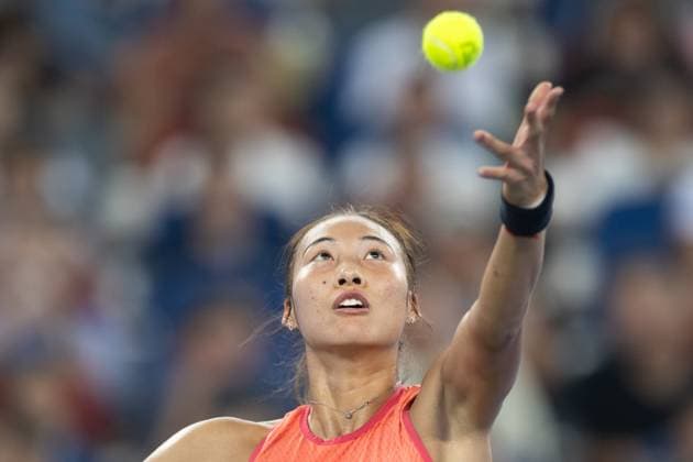 (241012) -- WUHAN, Oct. 12, 2024 -- Zheng Qinwen serves during the women s singles semifinal match between Zheng Qinwen of China and Wang Xinyu of China at the 2024 Wuhan Open tennis tournament in Wuhan, central China s Hubei Province, Oct. 12, 2024. ) (SP)CHINA-WUHAN-TENNIS-WUHAN OPEN-WOMEN S SINGLES (CN) XiaoxYijiu 