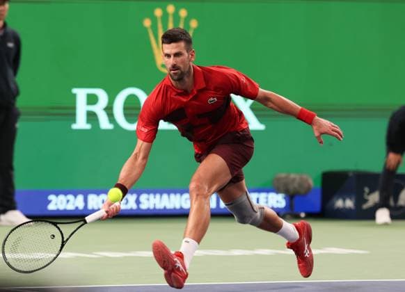(241012) -- SHANGHAI, Oct. 12, 2024 -- Novak Djokovic hits a return during the men s singles semifinal match between Taylor Fritz of the United States and Novak Djokovic of Serbia at the ATP, Tennis Herren World Tour Shanghai Masters tennis tournament in Shanghai, east China, Oct. 12, 2024. ) (SP)CHINA-SHANGHAI-TENNIS-ATP TOUR-SHANGHAI MASTERS(CN) WangxXiang 