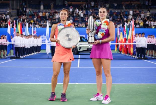 WUHAN, CHINA - OCTOBER 13: Champion Aryna Sabalenka (R) and runner-up Zheng Qinwen of China pose with their trophies during the awarding ceremony after the Women s Singles Final match on day nine of 2024 Wuhan Open at Optics Valley International Tennis Center on October 13, 2024 in Wuhan, Hubei Province of China.  Copyright: xVCGx 111523557133