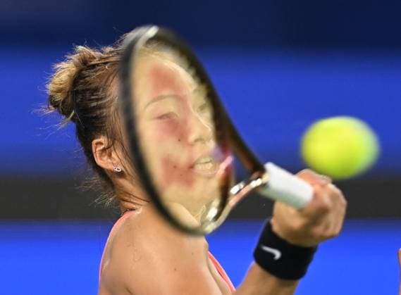 (241013) -- WUHAN, Oct. 13, 2024 -- Zheng Qinwen hits a return during the women s singles final match between Zheng Qinwen of China and Aryna Sabalenka of Belarus at the 2024 Wuhan Open tennis tournament in Wuhan, central China s Hubei Province, Oct. 13, 2024. ) (SP)CHINA-WUHAN-TENNIS-WUHAN OPEN-WOMEN S SINGLES-FINAL(CN) ChengxMin 