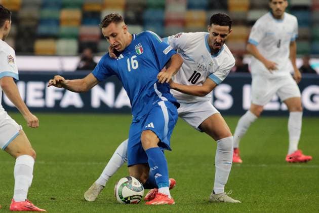 italian s davide frattesi fights for the ball with israel s dolev haziza during the Nations league soccer match between Italia and Israele at the Bluenergy Stadium in Udine, north east Italy - Monday, October 14,2024 - soccer  Copyright: xAndreaxBressanutti LaPressex