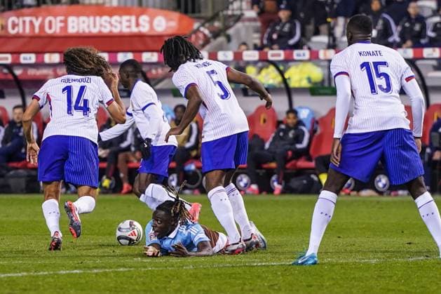 (241015) -- BRUSSELS, Oct. 15, 2024 -- Jeremy Doku (bottom) of Belgium falls during the UEFA Nations League 2024 25 League A Group A2 football match between Belgium and France in Brussels, Belgium, Oct. 14, 2024. ) (SP)BELGIUM-BRUSSELS-FOOTBALL-UEFA NATIONS LEAGUE A-BELGIUM VS FRANCE PengxZiyang 
