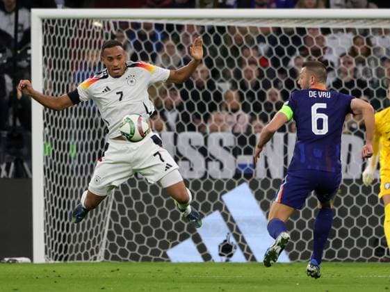 Sport Themen der Woche KW42 (241015) -- MUNICH, Oct. 15, 2024 -- Jamie Leweling (L) of Germany vies with Stefan De Vrij of the Netherlands during the UEFA Nations League A match between Germany and the Netherlands in Munich, Germany, Oct. 14, 2024. (Photo by Xinhua) (SP)GERMANY-MUNICH-FOOTBALL-UEFA NATIONS LEAGUE A-GERMANY VS NETHERLANDS PhilippexRuiz 