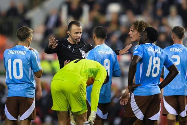 (241015) -- BRUSSELS, Oct. 15, 2024 -- Referee Irfan Peljto (2nd L) talks with players of Belgium during the UEFA Nations League 2024 25 League A Group A2 football match between Belgium and France in Brussels, Belgium, Oct. 14, 2024. ) (SP)BELGIUM-BRUSSELS-FOOTBALL-UEFA NATIONS LEAGUE A-BELGIUM VS FRANCE PengxZiyang 