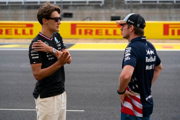 British Formula One driver George Russell of Mercedes-AMG Petronas speaks with Dutch Formula One driver Max Verstappen of Red Bull Racing before demonstration runs for guests during the Formula One United States Grand Prix at the Circuit of the Americas in Austin, Texas on Thursday, October 17, 2024.  AUS2024101719d GREGxNASH