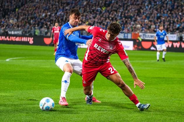 Julian Pauli (1. FC Koeln, 24) im Zweikampf mit Philip Förster (SV Darmstadt 98, 18), GER, SV Darmstadt 98 vs. 1. FC Koeln, Fussball, 2. Bundesliga, 9. Spieltag, Saison 2024 2025, 18.10.2024. DFL REGULATIONS PROHIBIT ANY USE OF PHOTOGRAPHS as IMAGE SEQUENCES and or QUASI-VIDEO. GER, SV Darmstadt 98 vs. 1. FC Koeln, Fussball, 2. Bundesliga, 9. Spieltag, Saison 2024 2025, 18.10.2024. Darmsatdt