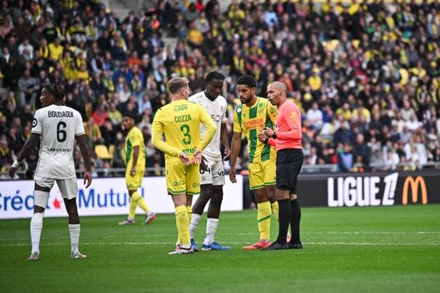 FC Nantes v OGC Nice - Ligue 1 McDonald s 2024 2025 64 Moise BOMBITO (ogcn) - 21 Jean Charles CASTELLETTO (fcn) - Gael ANGOULA (ARBITRE) during the Ligue 1 McDonald s match between Nantes and Nice at Stade de la Beaujoire on October 20, 2024 in Nantes, France. Nantes France  Copyright: xFEPx 776225453