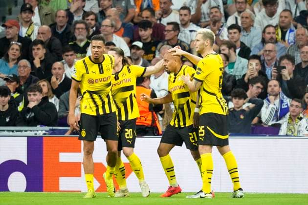 Real Madrid C.F. v Borussia Dortmund - UEFA Champions League 2024 25 League Phase MD3 Donyell Malen right winger of Borussia Dortmund and Netherlands celebrates after scoring his sides first goal during the UEFA Champions League 2024 25 League Phase MD3 match between Real Madrid C.F. and Borussia Dortmund at Estadio Santiago Bernabeu on October 22, 2024 in Madrid, Spain. Madrid Spain  Copyright: xJosexBretonx originalFilename:bretonhernandez-realmadr241022_np0IY.jpg