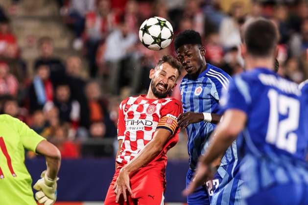 October 22, 2024, Girona, Girona, SPAIN: Cristhian Stuani of Girona FC and Sharani Zuberu of Slovan Bratislava compete for the ball during the UEFA Champions League, football match played between Girona FC and SK Slovan Bratislava at Estadio de Montilivi on October 22, 2024 in Girona, Spain. Girona SPAIN - ZUMAa181 20241022_zaa_a181_111 Copyright: xJavierxBorregox