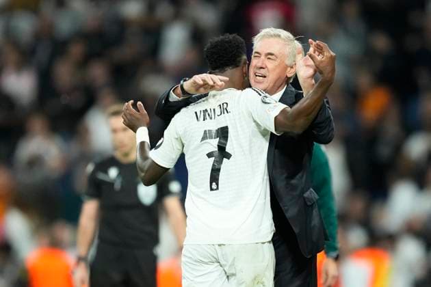 Real Madrid C.F. v Borussia Dortmund - UEFA Champions League 2024 25 League Phase MD3 Vinicius Junior left winger of Real Madrid and Brazil celebrates with Carlo Ancelotti head coach of Real Madrid after scoring his sides third goal during the UEFA Champions League 2024 25 League Phase MD3 match between Real Madrid C.F. and Borussia Dortmund at Estadio Santiago Bernabeu on October 22, 2024 in Madrid, Spain. Madrid Spain  Copyright: xJosexBretonx originalFilename:bretonhernandez-realmadr241022_npmSU.jpg