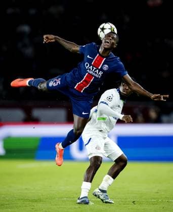 PARIS - Nuno Mendes of Paris Saint-Germain and Johan Bakayoko of PSV Eindhoven (l-r) during the UEFA Champions League match between Paris Saint-Germain and PSV Eindhoven at Parc des Princes on Oct. 22, 2024 in Paris, France. ANP ROBIN VAN LONKHUIJSEN UEFA Champions League 2024 25 xVIxANPxSportx xxANPxIVx 511592034 originalFilename: 511592034.jpg