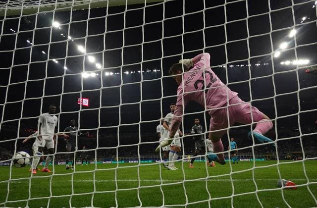 (241023) -- MILAN, Oct. 23, 2024 -- Club Brugge s goalkeeper Simon Mignolet (front) fails to save AC Milan s Christian Pulisic s goal during the UEFA Champions League match between AC Milan and Club Brugge in Milan, Italy, Oct. 22, 2024. (Photo by Xinhua) (SP)ITALY-MILAN-FOOTBALL-UEFA CHAMPIONS LEAGUE-AC MILAN VS CLUB BRUGGE AlbertoxLingria 