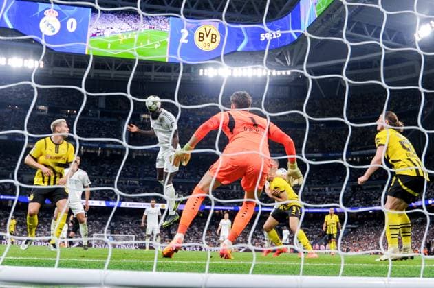 (241023) -- MADRID, Oct. 23, 2024 -- Antonio Rudiger (C) of Real Madrid heads to score during the third round match of UEFA Champions League between Real Madrid and Borussia Dortmund in Santiago Bernabeu stadium, Madrid, Spain, Oct. 22, 2024. (Photo by Xinhua) (SP)SPAIN-MADRID-FOOTBALL-UEFA CHAMPIONS LEAGUE-REAL MADRID VS DORTMUND GustavoxValiente 
