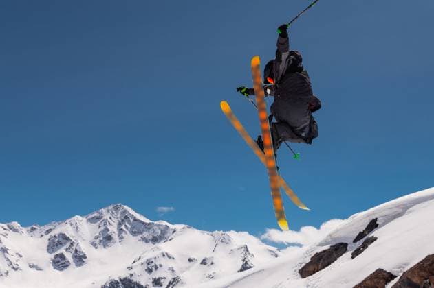Stylish skiing trick in snowy high sharp mountains. The athlete is flying Stylish skiing trick in snowy high sharp mountains. The athlete is flying. (License=RF) 22094587 ,model released, Symbolfoto Copyright: xZoonar.com IanxIankovskiix 22094587 ,model released, Symbolfoto ,property released
