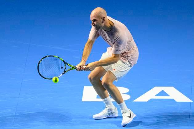 Basel, Switzerland - October 23: Adrian Mannarino of France returns a backhand against Stan Wawrinka of Switzerland during the Swiss Indoors Basel - Day 3 at St. Jakobshalle on October 23, 2024 in Basel, Switzerland. (Photo by JustPictures) Basel St. Jakobshalle Basel-Stadt Switzerland