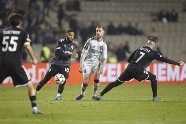 BAKOE, 24-10-2024, Tofiq Bahramov Stadium , season 2024 2025 , Europa League match between FK Qarabag and Ajax . Qarabag player Juninho and Ajax player Jordan Henderson Qarabag - Ajax  x26552951x Copyright:
