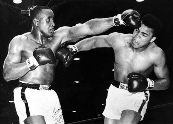 Orig. caption... CASSIUS WINS WORLD HEAVYWEIGHT CHAMPIONSHIP. Cassius Clay, 22, won the world heavyweight championship at Miami Beach, beating Sonny Liston, who retired from the contest and surrendered his title at the end of six rounds. Doctors, after examining 12 x-ray plates, diagnosed a torn tendon in the left shoulder of Liston. There are still many rumors flying about in Miami. Cassius Clay claims that there was something...either in Sonny s hair, or on his gloves which made his face and eyes burn. Whatever the outcome of this claim, the fight will go down as being one of the most exciting in Boxing history. Photo shows: Clay lands ... Sonny s body as Liston grazes Clay s head with a left. persons: Sonny Liston Cassius Clay sites  Copyright: xXxXxXx CLAY VS. LIST xx *** Orig caption CASSIUS WINS WORLD HEAVYWEIGHT CHAMPIONSHIP Cassius Clay, 22, won the world heavyweight championship at Miami Beach, beating Sonny Liston, who retired from the contest and surrendered his title at the end of six rounds Doctors, after examining 12 x ray plates, diagnosed a torn tendon in the left shoulder of Liston There are still many rumors flying about in Miami Cassius Clay claims that there was something either in Sonny s hair, or on his gloves which made his face and eyes burn Whatever the outcome of this claim, the fight will go down as being one of the most exciting in Boxing history Photo shows Clay lands Sonny s body as Liston grazes Clay s head with a left persons Sonny Liston Cassius Clay sites  Copyright xXxXxXx CLAY VS LIST xx  Copyright: xIMAGO XxXxXx imago images 0769626034