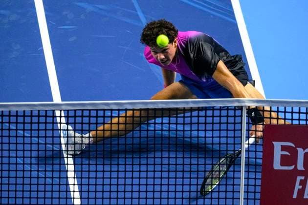 Basel, Switzerland - October 24: Ben Shelton of USA stretches to play the forehand against Stan Wawrinka of Switzerland during the Swiss Indoors Basel - Day 4 at St. Jakobshalle on October 24, 2024 in Basel, Switzerland. (Photo by JustPuctures) Basel St. Jakobshalle Basel-Stadt Switzerland