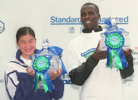 The Standard Chartered International Marathon-- Women s & Men s open. Winner of Zheng Guixia, 25yrs (China) results: 2:36:52 and Charles Tangus, 24yrs, (Kenya); results: 2:17:00, with their trophies at Shamshuipo Sports Ground. 28 feb 99 HONG KONG CHINA EDITORIAL USE ONLY  Copyright: xx MER2016050919023848 DAVIDxWONGx scmpphotos007354