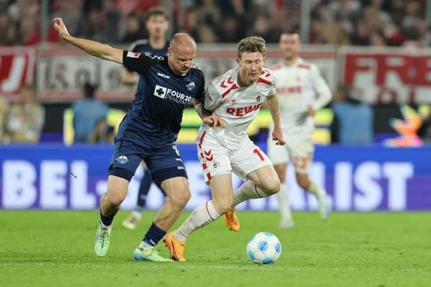 GER, 2.FBL. 1. FC Koeln vs. SC Paderborn 25.10.2024, Rheinenergie Stadion, Koeln, GER, 2.FBL. 1. FC Koeln vs. SC Paderborn, im Bild: Florian Kainz (FC Koeln 11), im Zweikampf gegen Sven Michel (Paderborn 11),