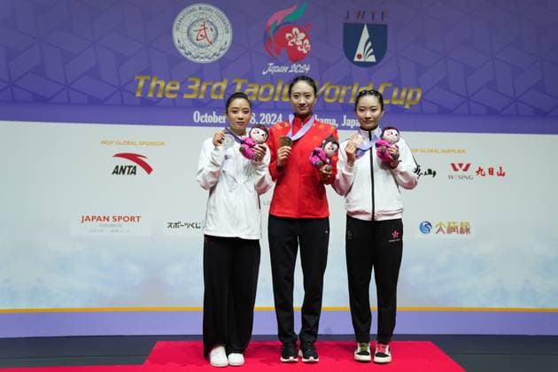 (241026) -- YOKOHAMA, Oct. 26, 2024 -- Yao Yang (C) of China, Duong Thuy Vi (L) of Vietnam and Sham Hui Yu Lydia of China s Hong Kong pose for photos during the awarding ceremony of the Women s Jianshu competition of the 3rd Taolu World Cup held in Yokohama, Japan, on Oct. 26, 2024. ) (SP)JAPAN-YOKOHAMA-WUSHU-3RD TAOLU WORLD CUP-WOMEN S JIANSHU ZhangxXiaoyu 