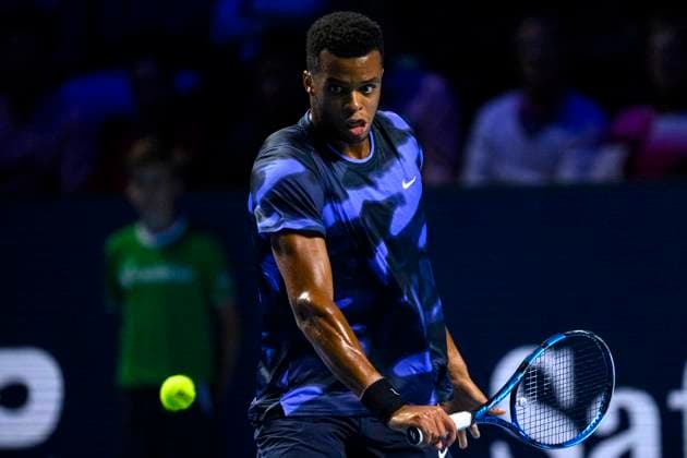 BASEL, SWITZERLAND - OCTOBER 26: Giovanni Mpetshi Perricard of France plays a backhand against Holger Rune of Norway during the Swiss Indoors Basel - Day 6 at St. Jakobshalle on October 26, 2024 in Basel, Switzerland. (Photo by JustPictures) Basel St. Jakobshalle Basel-Stadt Switzerland