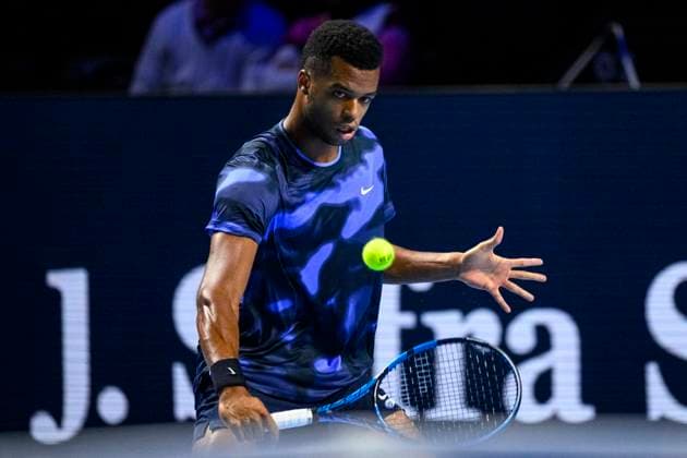 BASEL, SWITZERLAND - OCTOBER 26: Giovanni Mpetshi Perricard of France plays a backhand against Holger Rune of Norway during the Swiss Indoors Basel - Day 6 at St. Jakobshalle on October 26, 2024 in Basel, Switzerland. (Photo by JustPictures) Basel St. Jakobshalle Basel-Stadt Switzerland