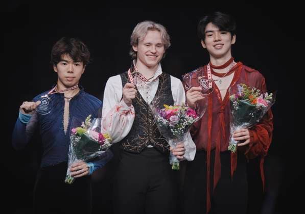 Shun Sato of Japan, Ilia Malinin of the U.S. and Junhwan Cha of Korea pose on the podium at the ISU Figure skating, Eiskunstlauf Skate Canada competition on October 27, 2024 in Halifax, Canada. Malinin won the competition. Noxthirdxpartyxsales  (271370385)