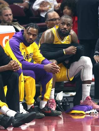Sport Themen der Woche KW44 Sport Bilder des Tages Los Angeles Lakers Lebron James (23) (R) sits on the bench next to his son Bronny James Jr. (9) during the Lakers game against the Cleveland Cavaliers in Cleveland, Ohio Wednesday October 30, 2024.  CLE20241030104 AARONxJOSEFCZYK