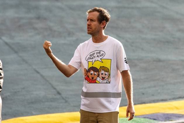 Sebastian Vettel portrait at Senna Tribute with gigant replica Senna helmet, casque, created by local artists working with Sebastian Vettel and Senna Foundation during the Formula 1 Grande Premio de Sao Paulo 2024, 21th round of the 2024 Formula One World Championship, WM, Weltmeisterschaft from November 1 to 3, 2024 on the Interlagos Circuit, in Sao Paulo, Brazil - F1 - SAO PAULO GRAND PRIX 2024 DPPI Panoramic  241031_R21_BRASILE_DP_XB3_0043