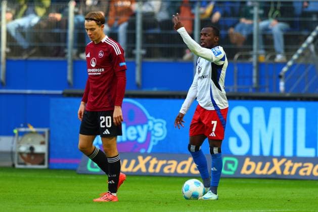 GER, Hamburg, Fussball, DFB, HSV vs 1. FC Nuernberg, im Volkspark Stadion, 03.11.2024, v.l. Caspar Jander (1. FC Nuernberg) , Jean-Luc Dompe (Hamburger SV) DFL regulations prohibit any use of photographs as image sequences and or quasi-video.
