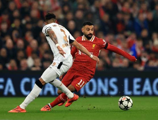 Liverpool, England, 5th November 2024. Mohamed Salah of Liverpool with Piero Hincapie of Bayer Leverkusen during the UEFA Champions League match at Anfield, Liverpool. Picture credit should read: Jessica Hornby Sportimage EDITORIAL USE ONLY. No use with unauthorised audio, video, data, fixture lists, club league logos or live services. Online in-match use limited to 120 images, no video emulation. No use in betting, games or single club league player publications. SPI-3439-0023