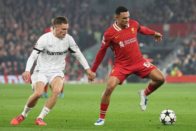 Trent Alexander-Arnold of Liverpool under pressure from Florian Wirtz of Bayer 04 Leverkusen Liverpool v Bayer 04 Leverkusen, UEFA Champions League, Group Stage, Football, Anfield, Liverpool, UK - 05 Nov 2024 EDITORIAL USE ONLY No use with unauthorised audio, video, data, fixture lists, club league logos or live services. Online in-match use limited to 120 images, no video emulation. No use in betting, games or single club league player publications. Copyright: xPaulxCurrie Shutterstockx 14863785ba