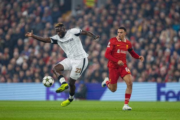 Football - UEFA Champions League - League Phase - Liverpool FC v Bologna FC 1909 LIVERPOOL, ENGLAND - Wednesday, October 2, 2024: Bayer Leverkusen s Victor Boniface (L) is challenged by Liverpool s Trent Alexander-Arnold during the UEFA Champions League game between Liverpool FC and Bologna FC 1909 at Anfield. (Photo by David Rawcliffe Propaganda) LIVERPOOL Anfield MERSEYSIDE ENGLAND  Copyright: xDavidxRawcliffex P2024-11-05-Liverpool_Leverkusen-15